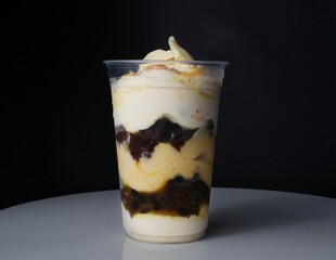 chocolate in glass with strawberries  on a black background