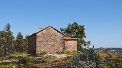 Stone church in the middle of a eucalyptus meadow.