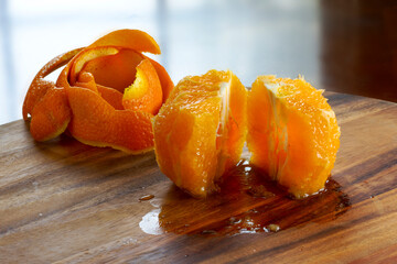 Peeled orange on a cutting board