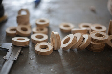 Wooden circles. Blanks for threading the cord through wooden rings. 