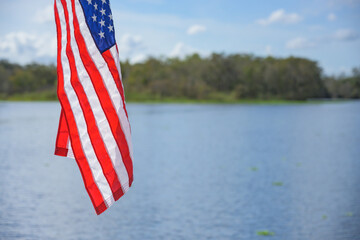 American Flag Hangs Over Water