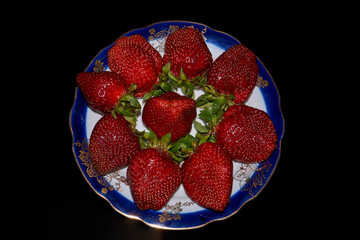 The first strawberry of 2020 from its garden.