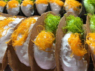 Kanom Bueang is an ancient Thai dessert known as crispy pancakes in English. It is a popular form of street food in Thailand.