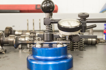 Valve of the camshaft drive in the process of checking on the device with an indicator head