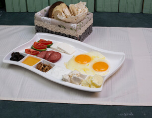 Breakfast platter with fried eggs and bread slices
