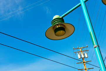 A street lamp and power transformer are attached to the electrical grid.