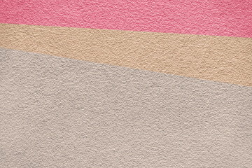 Rose pink and earth tone colors of cement wall background texture divided into three parts. Surface of concrete texture in 3 tone background colors.