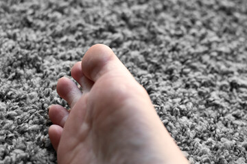foot and toes on the carpet