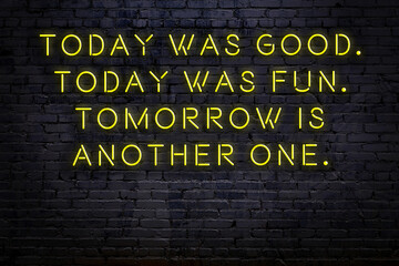 Smart and motivational quotation. Neon sign on brick wall