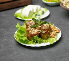 Fried eggplant rolls on a lettuce leaf