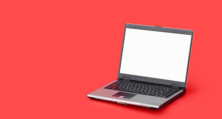 Laptop notebook mock up with color red background. Colored background concept.
