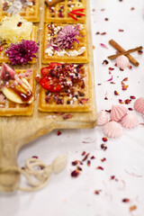 waffles on a wooden board with blurred background
