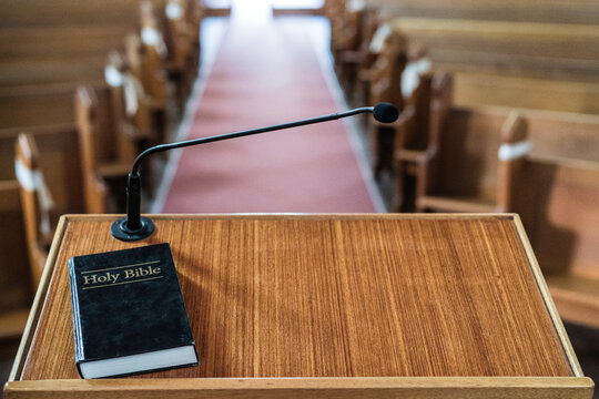 Bible on church pulpit in empty church