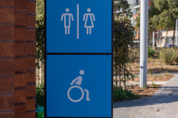 disabled blue toilet sign at park
