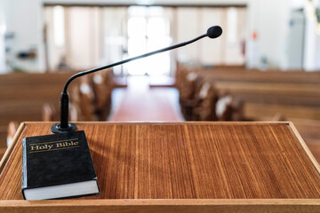 bible on pulpit in church, with light coming in through the front door
 - obrazy, fototapety, plakaty