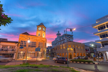 sunset behind the old architectural style in Phuket city.the clock tower was built in Chino portuguese style..