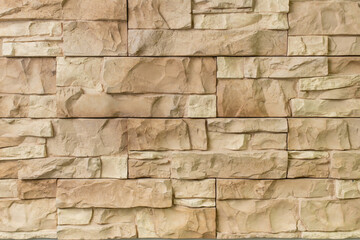 Obraz premium New materials in construction. The artificial stone imitating a brick wall. Seamless texture.