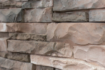 New materials in construction. The artificial stone imitating a brick wall. Seamless texture.
