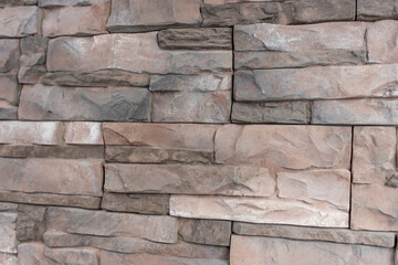 New materials in construction. The artificial stone imitating a brick wall. Seamless texture.