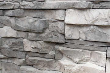 New materials in construction. The artificial stone imitating a brick wall. Seamless texture.