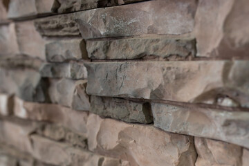 Fototapeta premium New materials in construction. The artificial stone imitating a brick wall. Seamless texture.