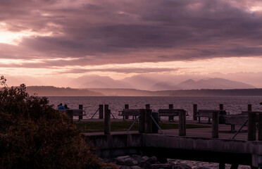 View towards the Olympic Mountains across from Alki Beach in West Seattle on a late summer day....