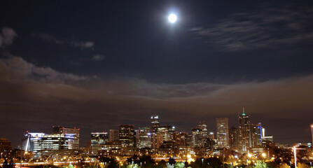 Fototapeta na wymiar bright full moon over the Denver skyline, taken in 2012