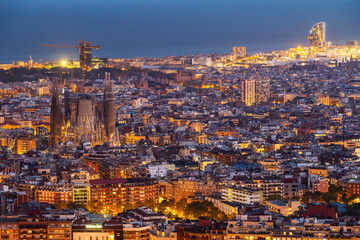 Aerial view of Barcelona cityscape at dusk, Spain.