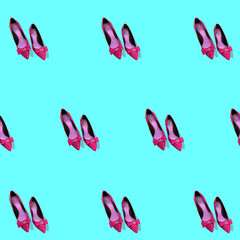 background, pattern with pink women's high heel shoes on a blue background