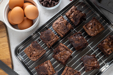 chocolate brownies with ingredients and baking tools