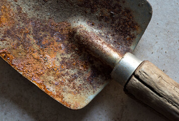 old rusty shovel up close showing rust patterns