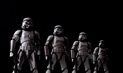 Naklejka premium NEW YORK, USA - JULY 29 2016 - Star Wars Stormtroopers lined up with dramatic lighting - Hasbro Black Series 6 inch action figures.