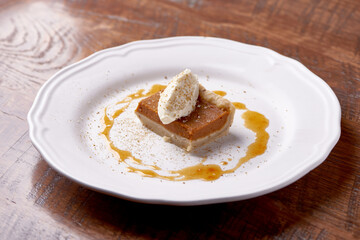 Pumpkin Pie with Whipped Cream on Plate