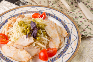 chicken and cabbage salad with radishes and apples.