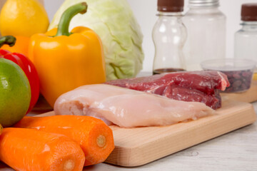 Vegetables and meat on a cutting board