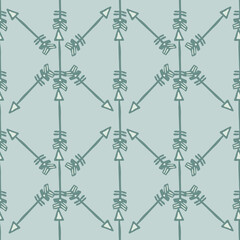 Hand drawn geometric arrows seamless pattern isolated on green background.Tribal endless wallpaper in doodle style.