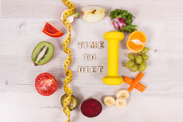 Fototapeta na wymiar Inscription time to diet, fuits and vegetables, dumbbell and tape measure, concept of healthy lifestyles