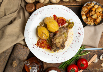 delicious meat and potato meal on dark background