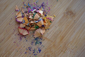pencils color shaving of various colors on wooden table