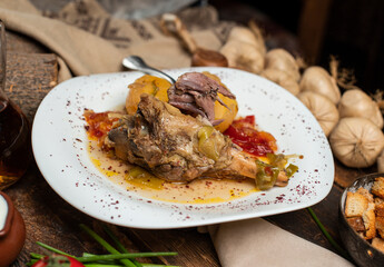 delicious meat meal with garlic, tomato on the table