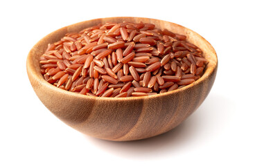 uncooked red rice in the wooden bowl, isolated on white background