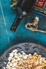 Popcorn , caramel corn and wheat corn snackes in a platter , top view