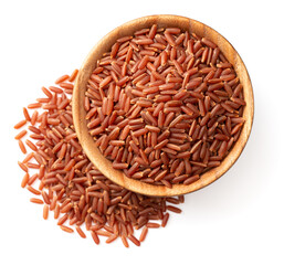 uncooked red rice in the wooden bowl, isolated on white background, top view