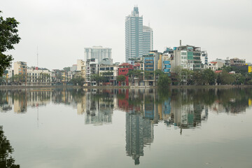 Fototapeta na wymiar Urban cityscape in front of West lake of Hanoi which is capital of Vietnam