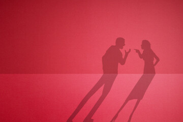 The shadow of a quarreling couple.
fight between husband and wife.