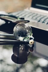 glass globe, stethoscope and computer on table