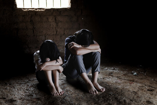 Child in catch the iron prison, Human trafficking and children prisoner concept, human rights violations,