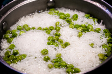 Indian Pulav or vegetables rice, Rise with fresh Peas rise, Ingredients rice, green peas. isolated on black background. 

