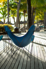 Butterfly chairs on wooden deck