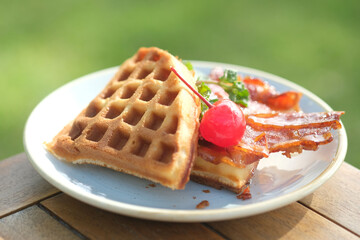 delicious waffles with strawberry jam on the table at the morning